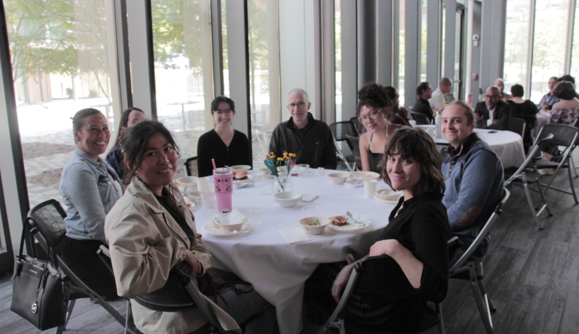People sit around a table.