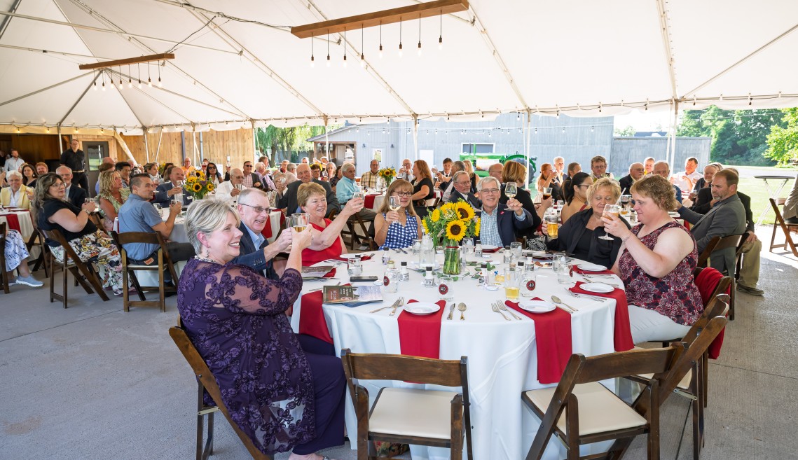 People sitting at a celebratory dinner event.
