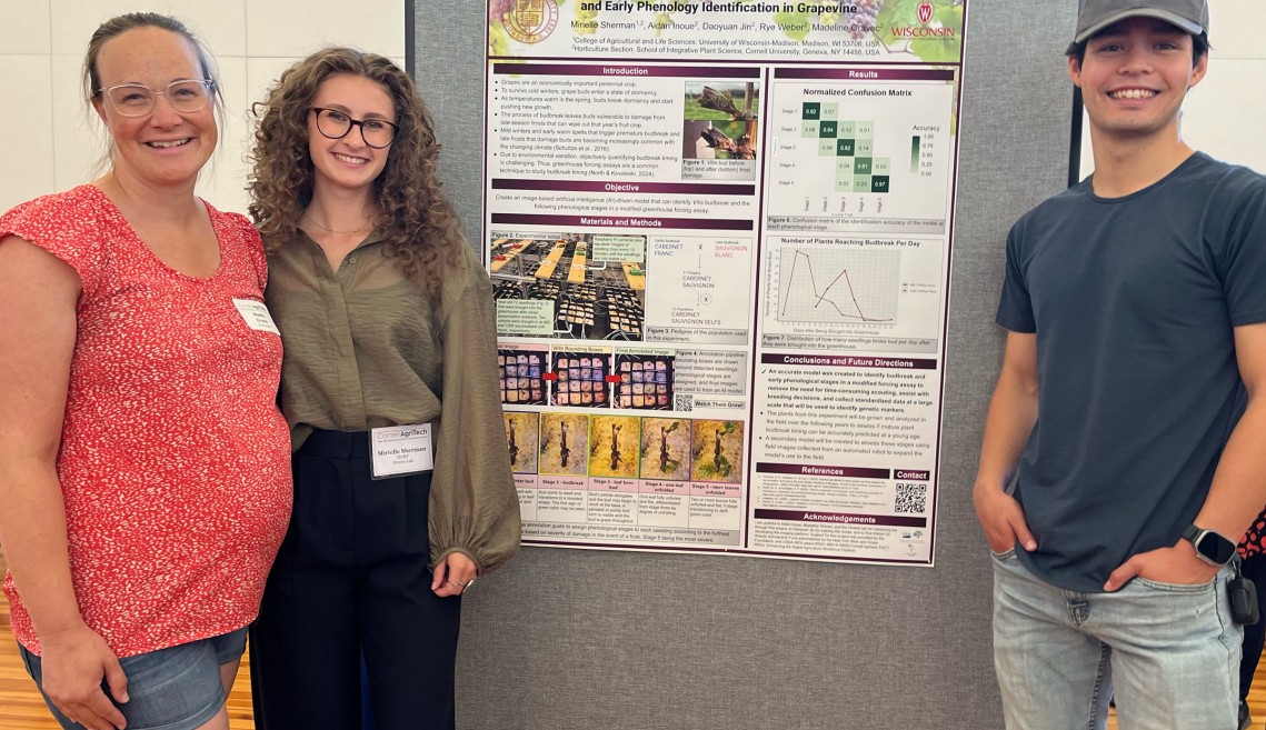 Mirielle poses in front of her poster with assistant professor Maddy Oravec and Ph.D. student Aidan Inoue.