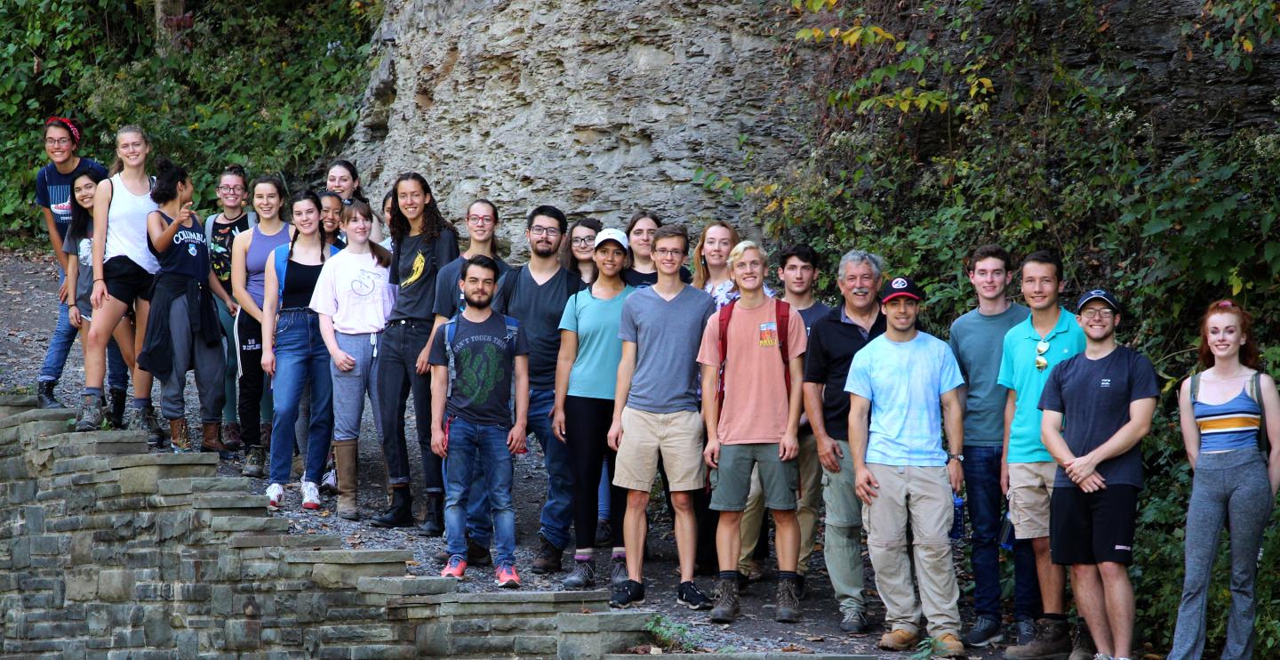 people in front of a waterfall
