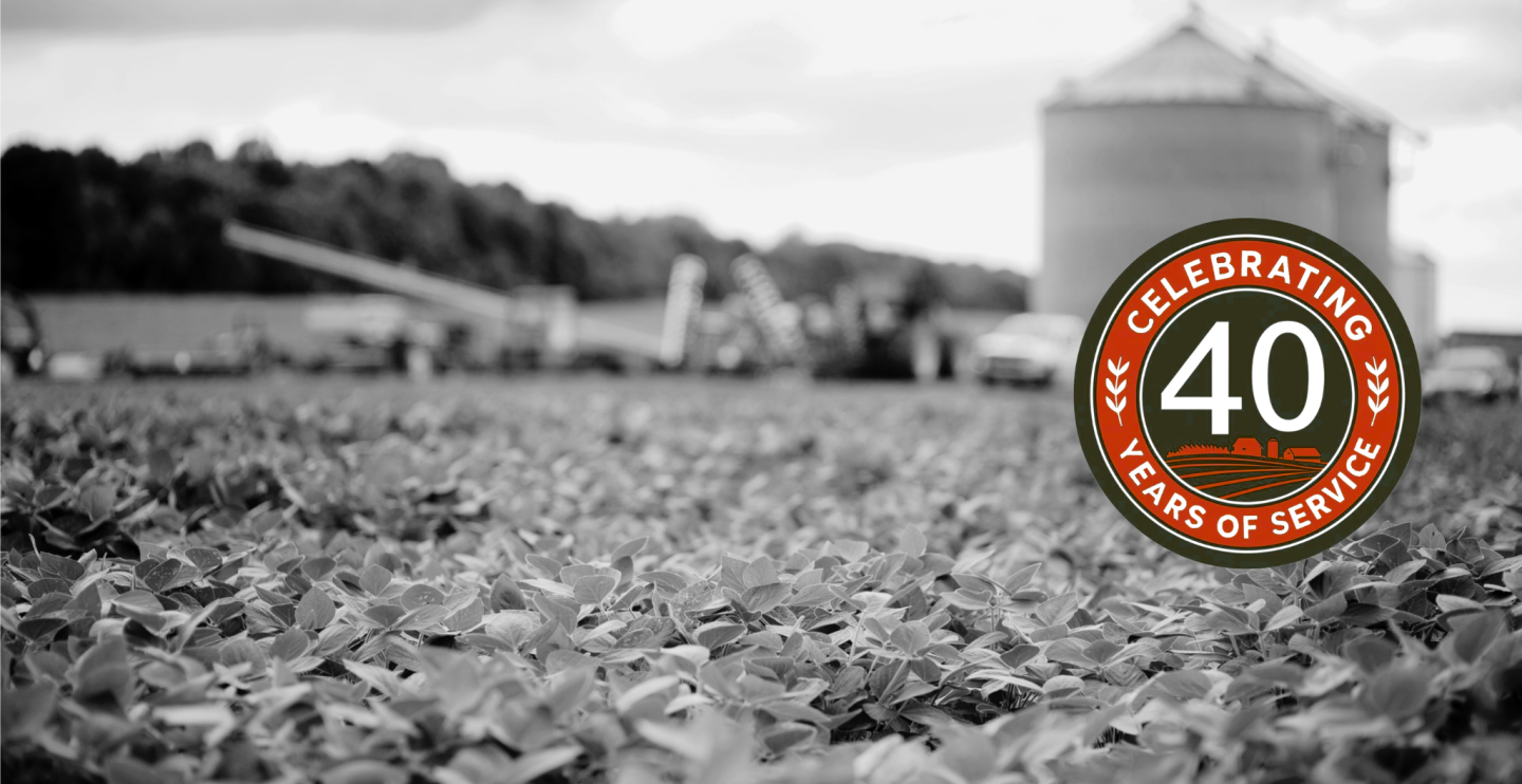 A farm and the NY FarmNet 40th Anniversary logo