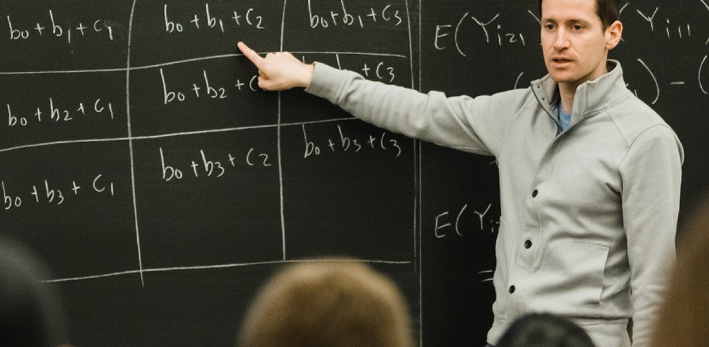 Biometry and Statistics professor giving a lecture.