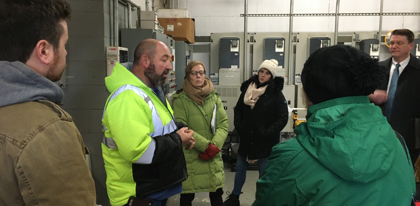 people taking a tour of resilience upgrades at a waste water treatment plant