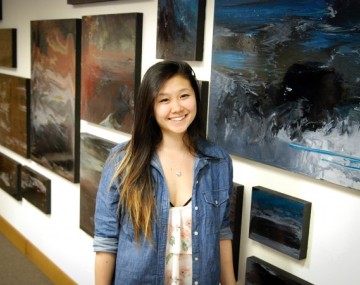 Student Viola Yu showcases her art in Mann Library.