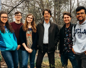 Students pose outside with photographer James Balog.