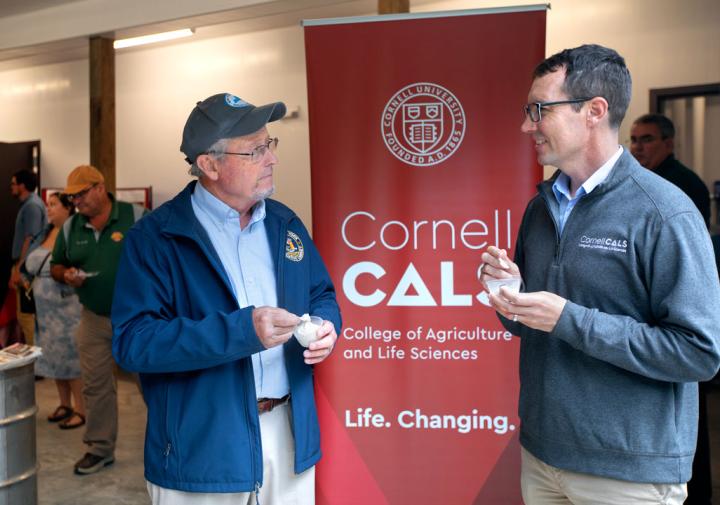 Richard Ball, left, talks with Benjamin Houlton inside the Arnot Maple Facility