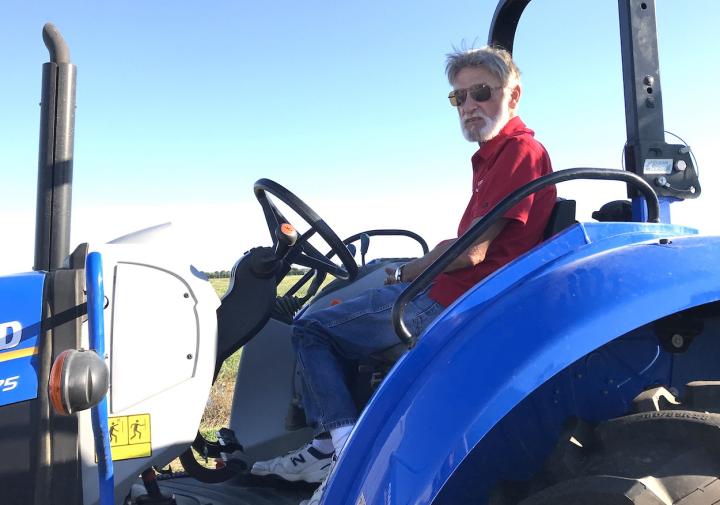 Man driving a modern tractor