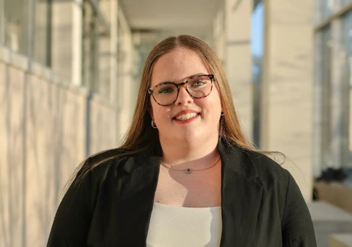 smiling woman in suit with white shirt