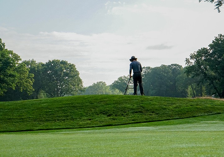 hand mowing at bethpage