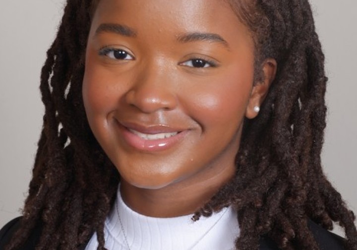 smiling woman with white shirt and suit jacket