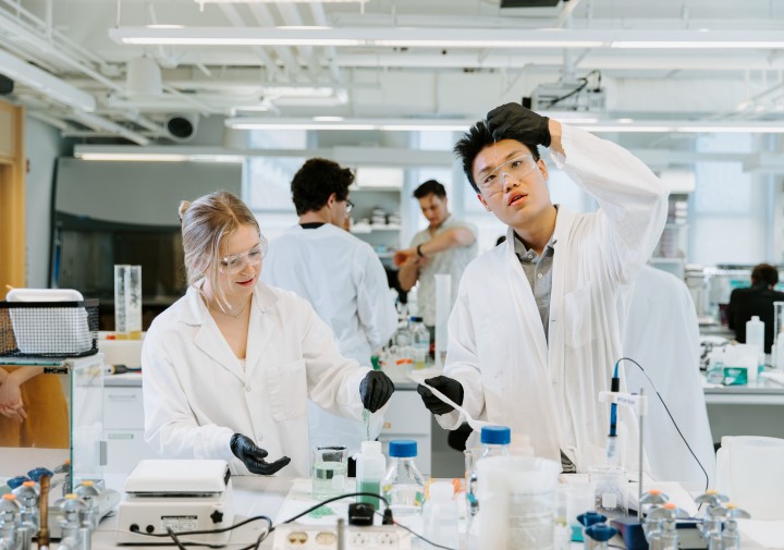 Two students work in a food science lab.