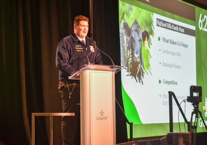 Mason Hill presenting on stage at Grow NY