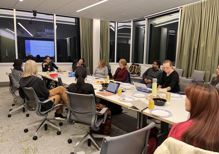 people sit around a conference table