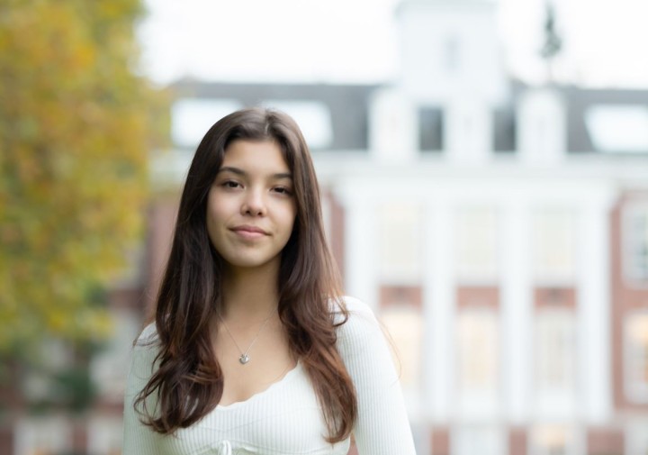 Smiling woman in white top