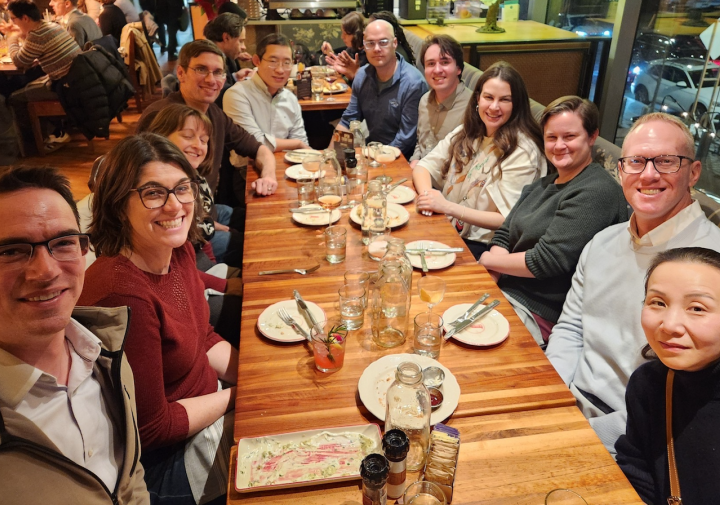 group sits around dinner table