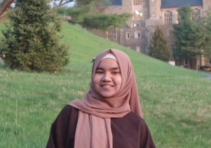 Smiling woman in brown scarf