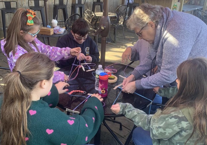 Elcsisin with youth doing a project