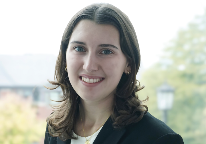 Smiling woman with black suit jacket