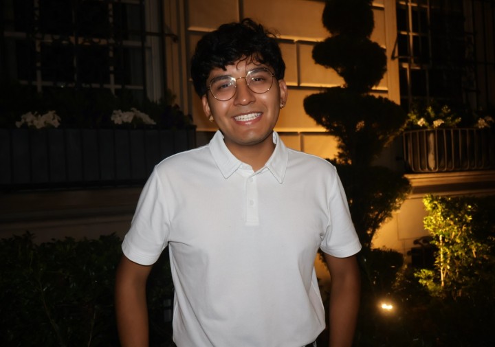 Smiling man in white shirt