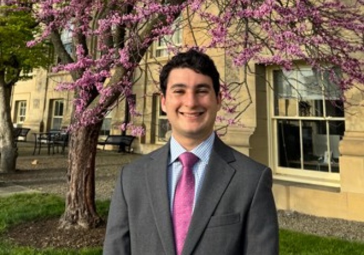Smiling man with pink tie
