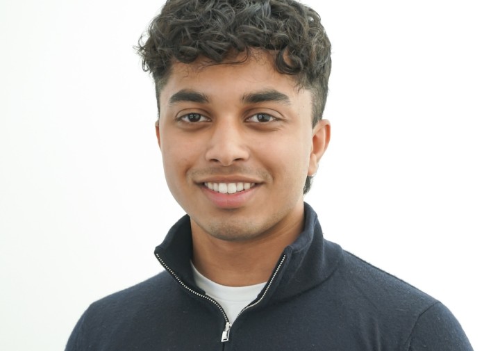 Smiling man with sweater with collar up