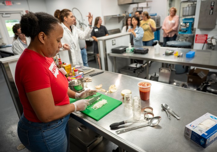 A group of people working in a commercial kitchen