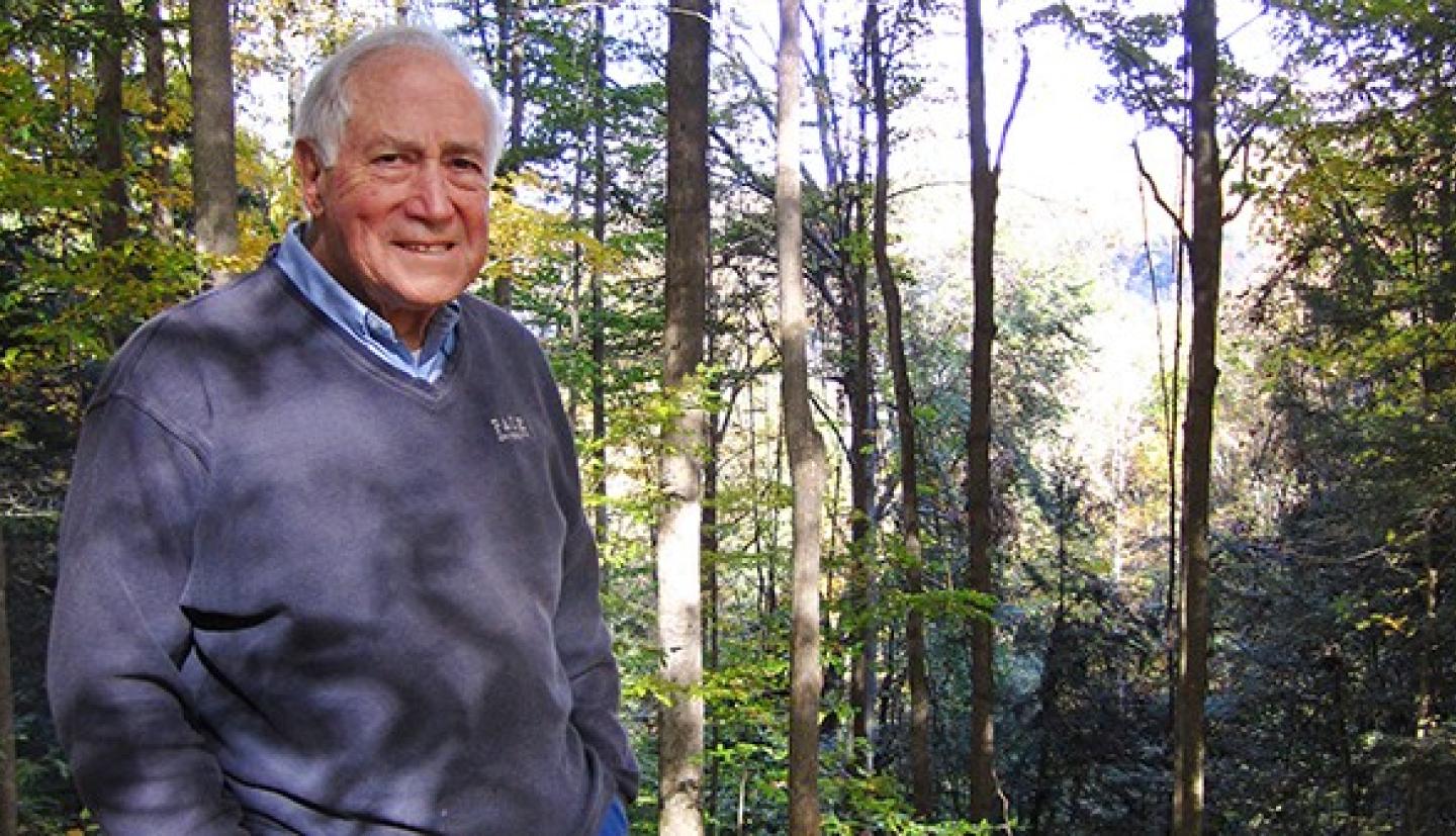 David Bandler poses for a photo in the forest