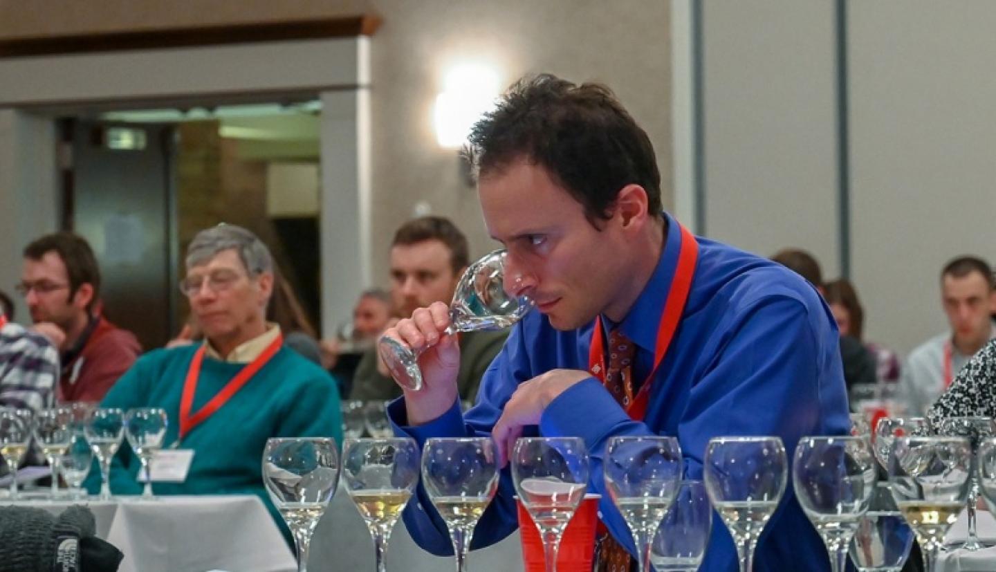 Cornell Food Science Associate Professor Gavin Sacks samples canned wine
