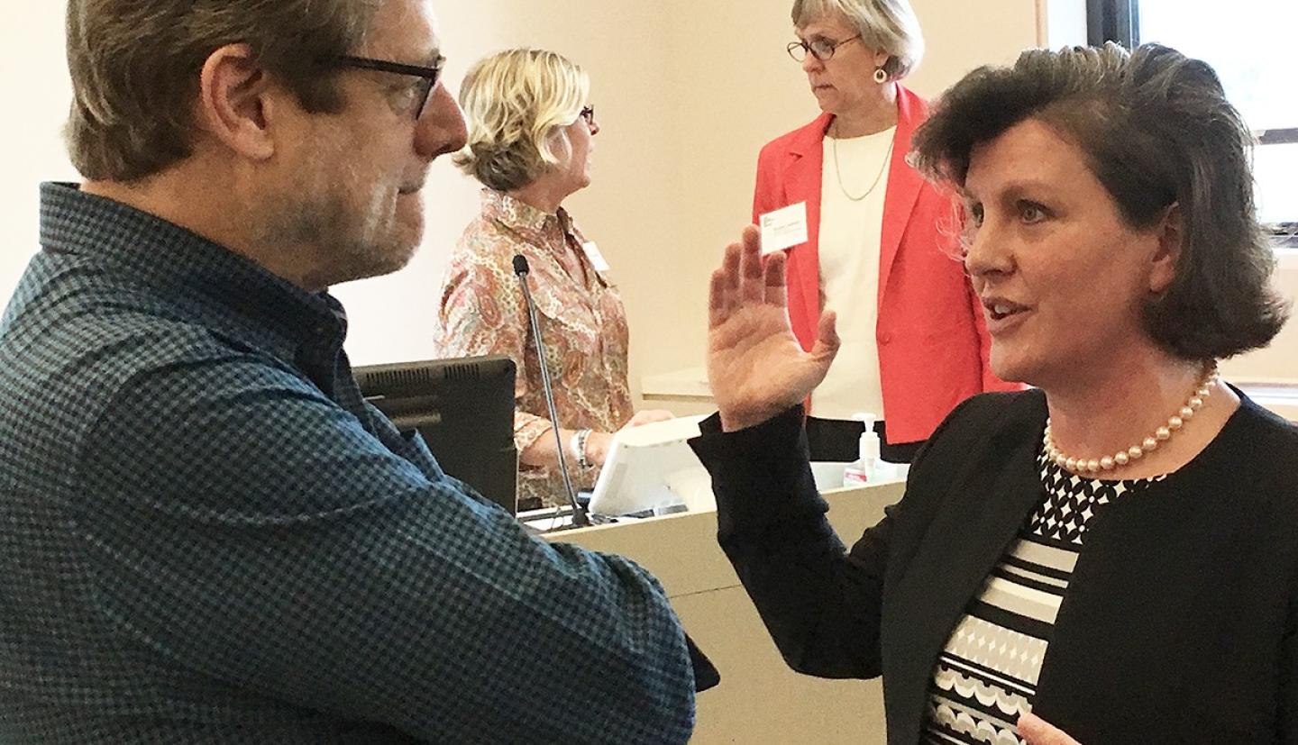 Mayor Miner has a discussion with a constituent