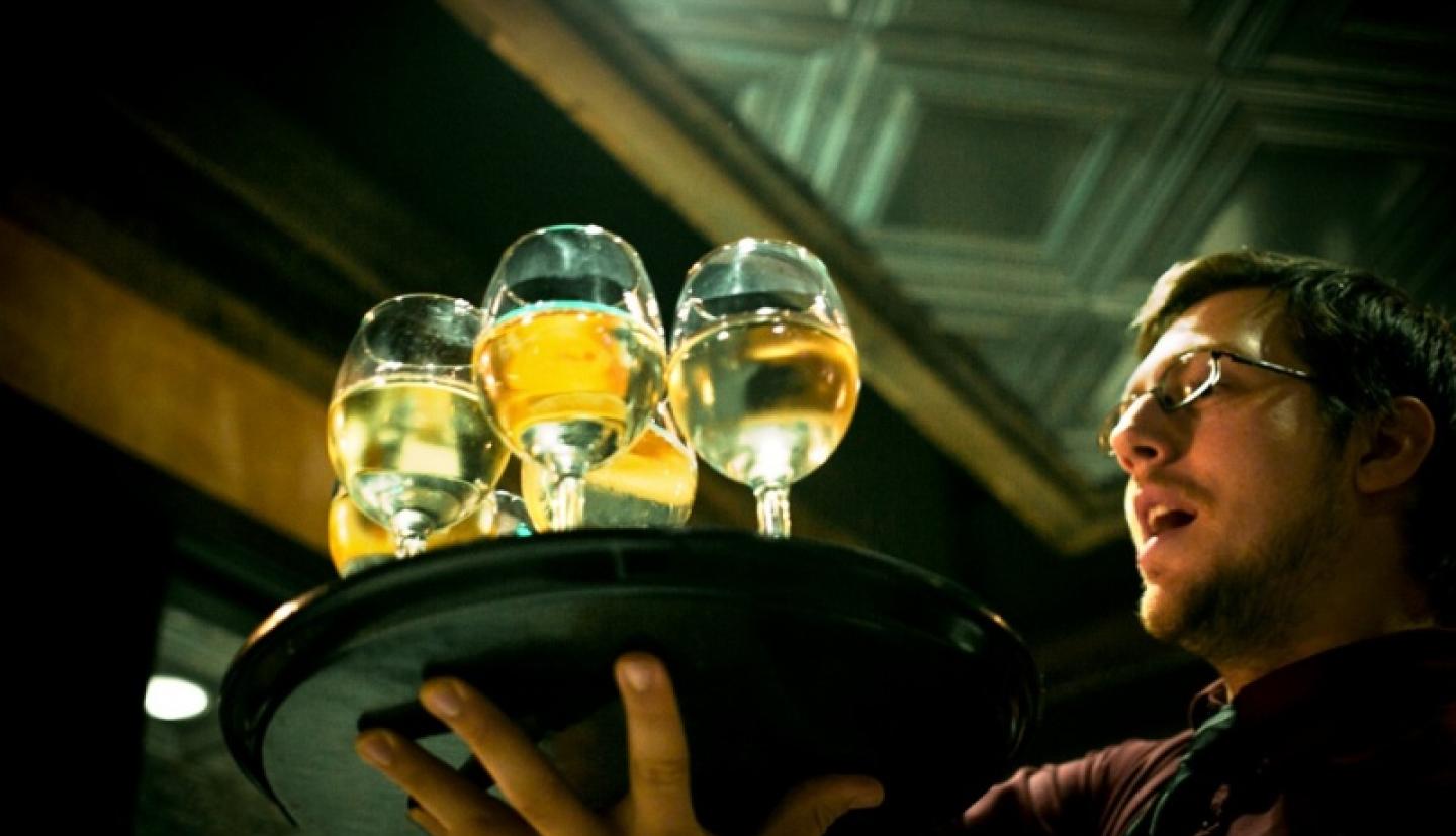 Waiter with glasses of Hard Cider