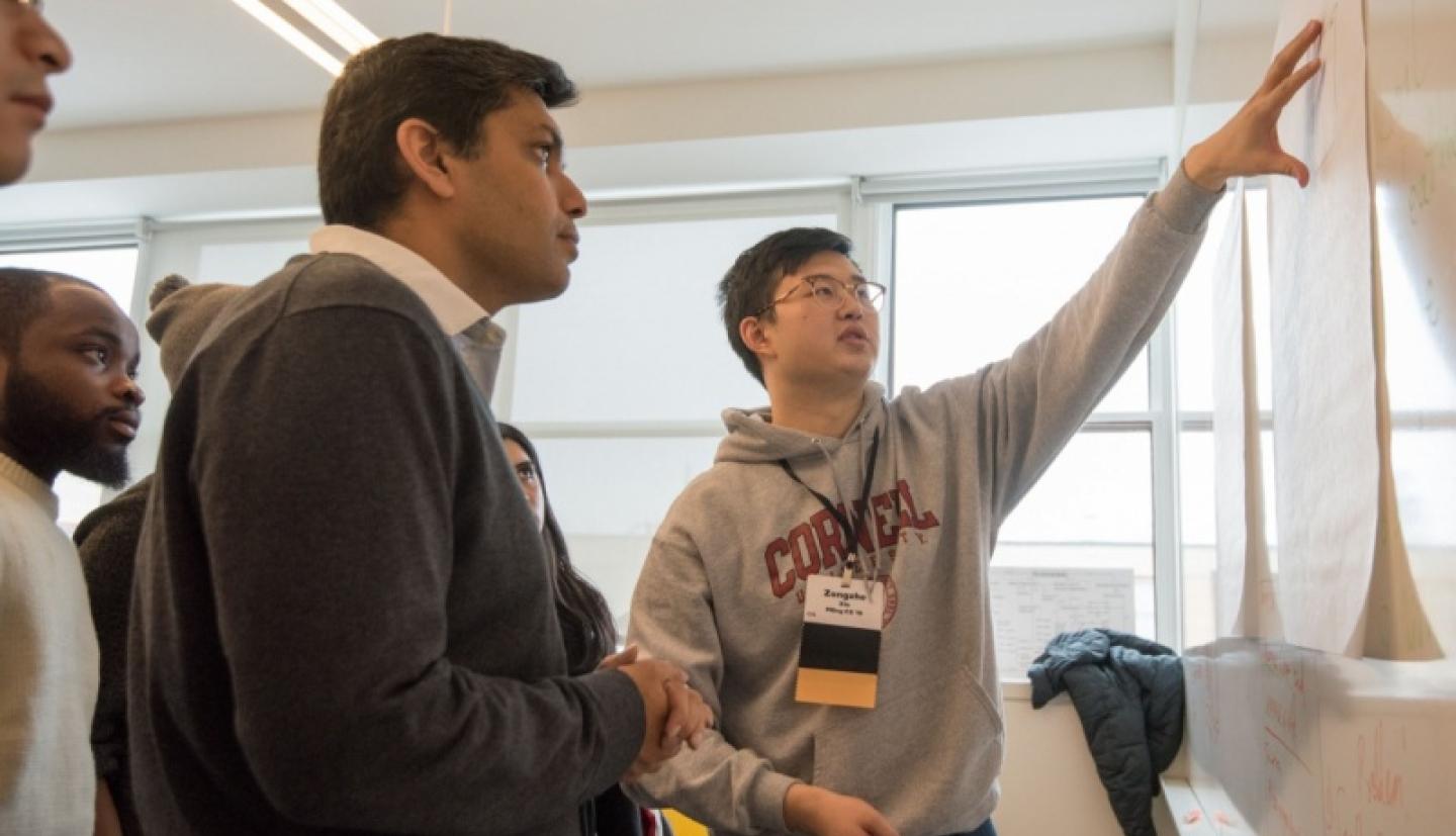 Hackathon participants collaborating on digital agriculture solutions