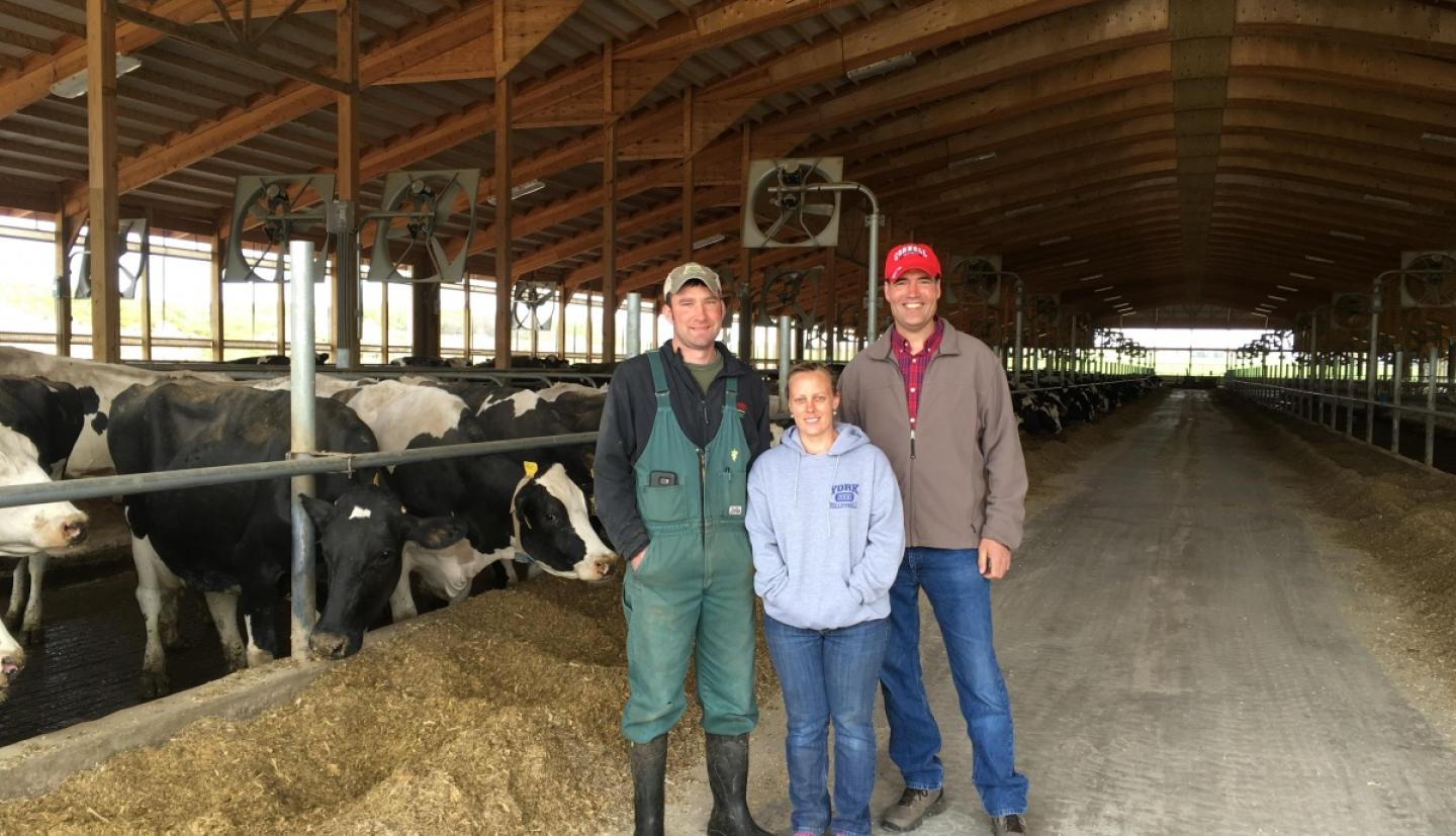 Richard Stup with Tim and Kristy Northrop at livestock farm