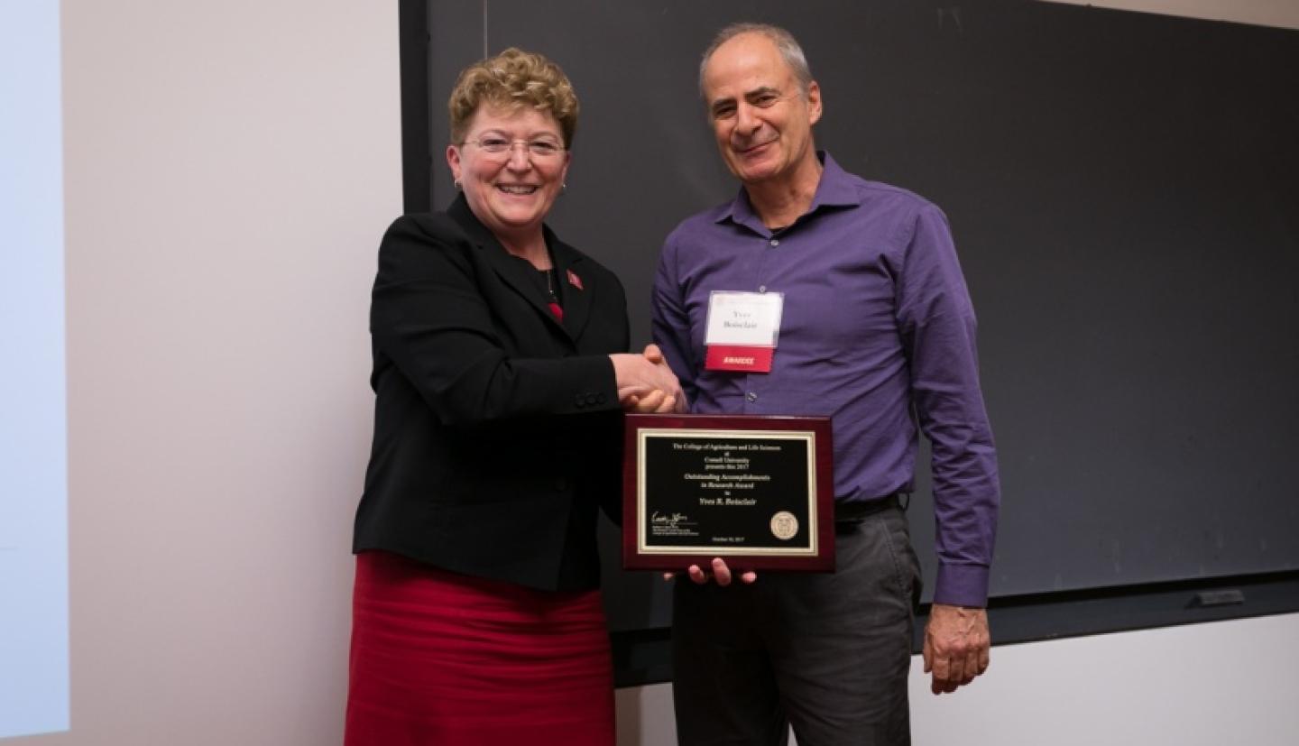 Dean Boor shakes hands with Yves Boisclair
