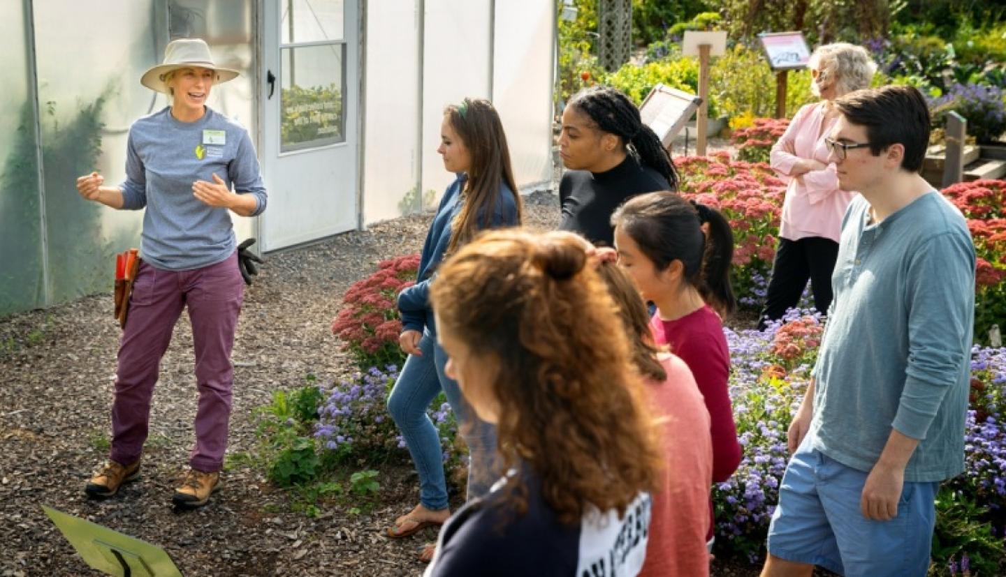 Detrick talks with students