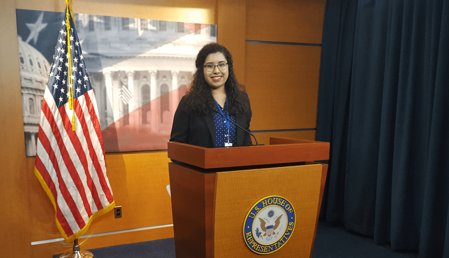 Student stands at a congressional podium