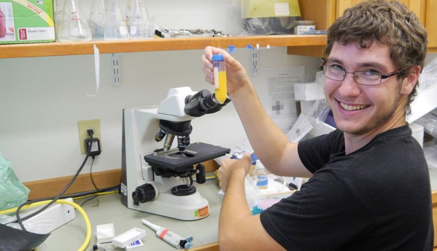Student working with microscope