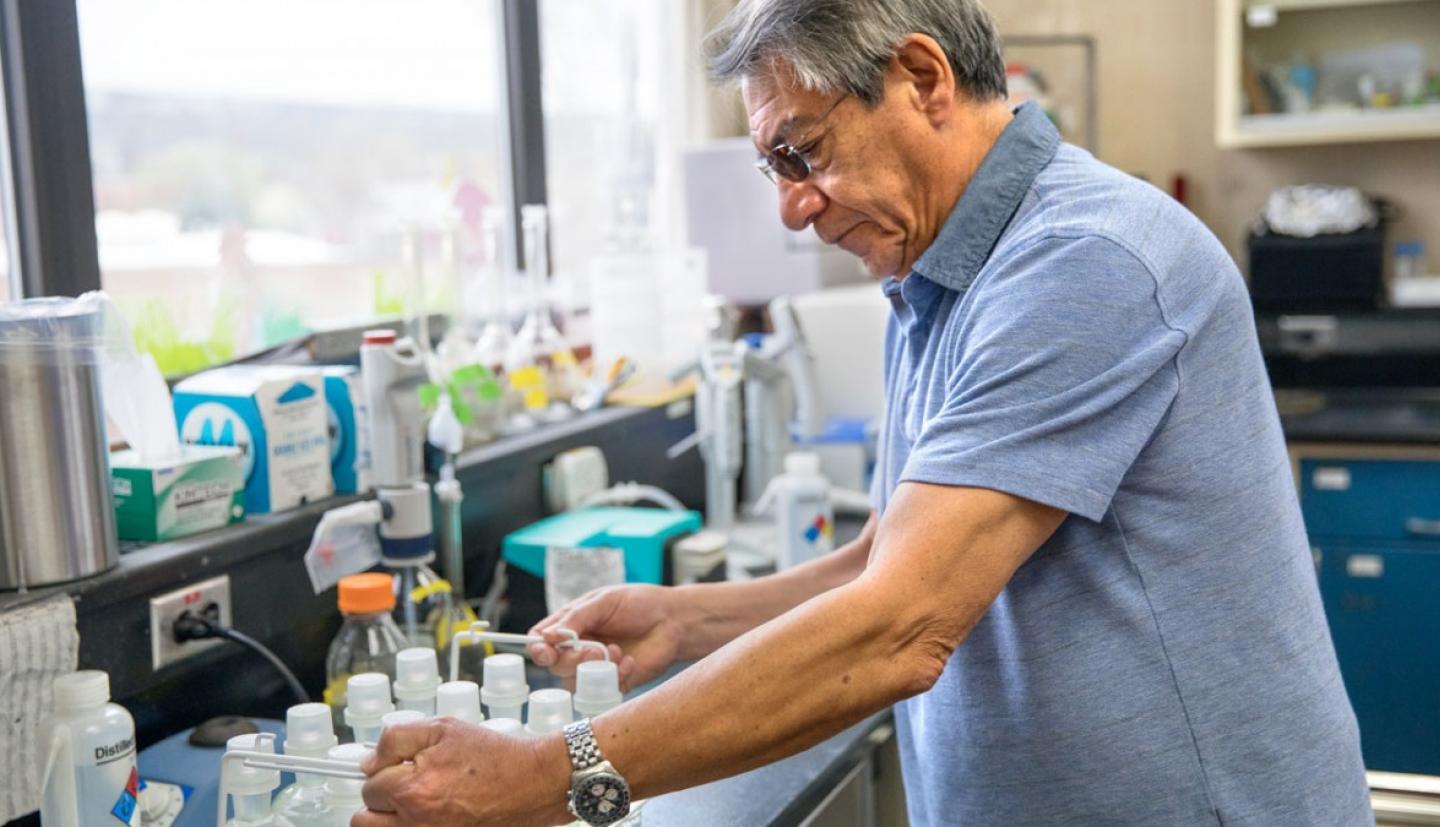 Jose Lozano stands in a lab