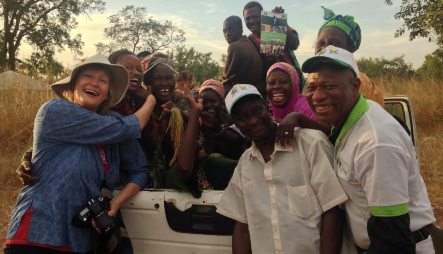 Researchers stand around truck
