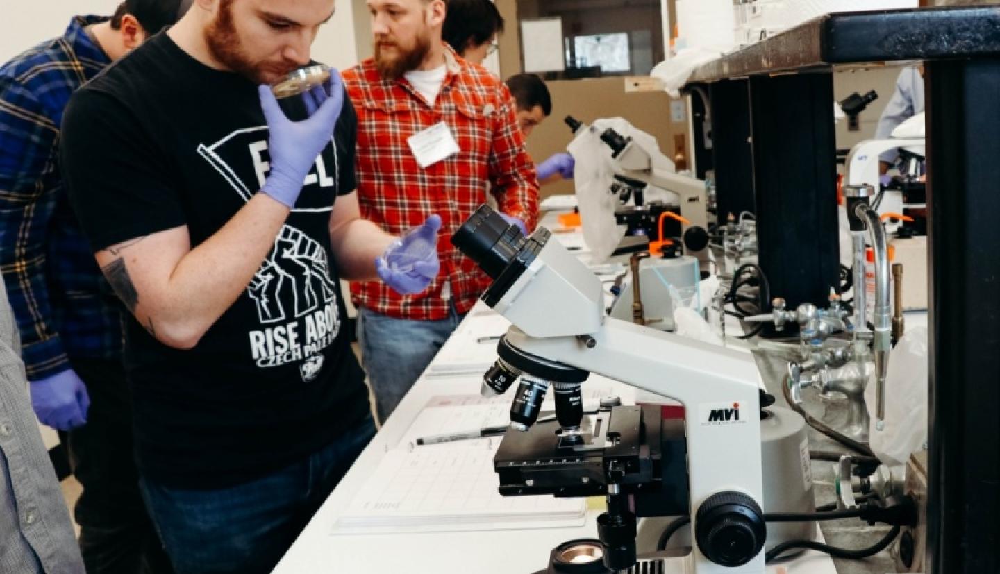 Jacob Crusade smells a yeast sample.