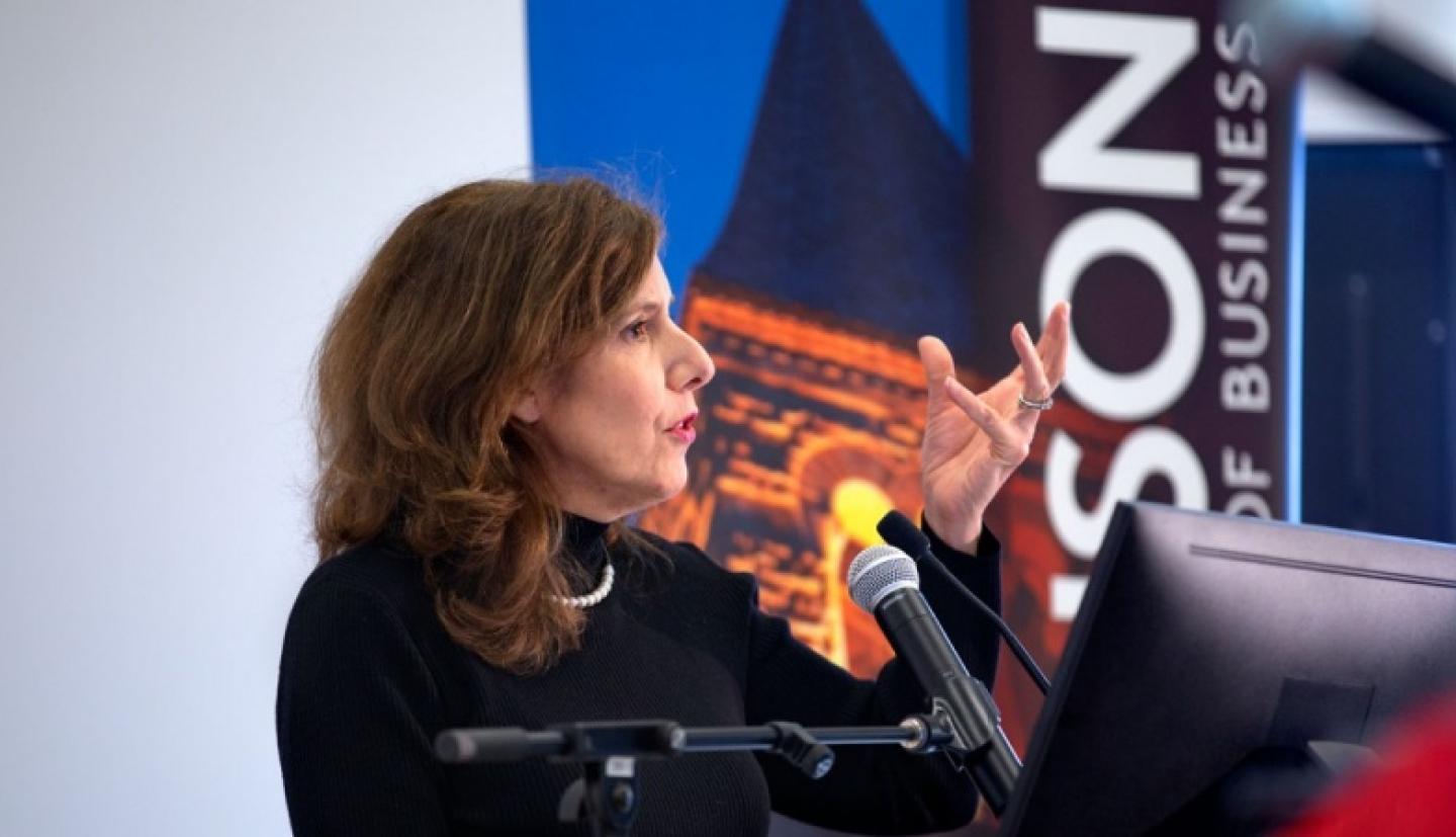 Kate Walsh speaking at podium