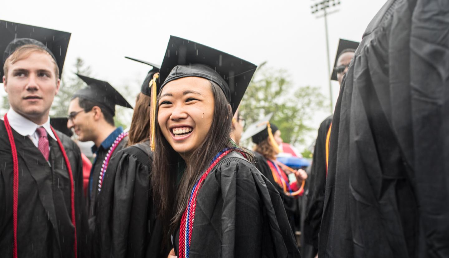 Graduates smile in the rain