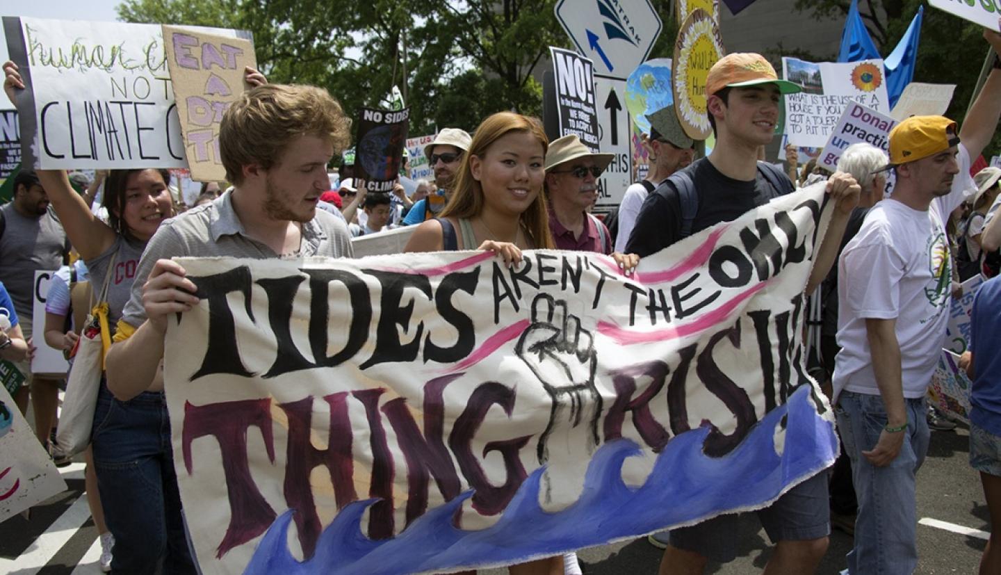 Brendon Brown, Elizabeth Couse, and Daniel Szabo march down Pennsylvania Avenue