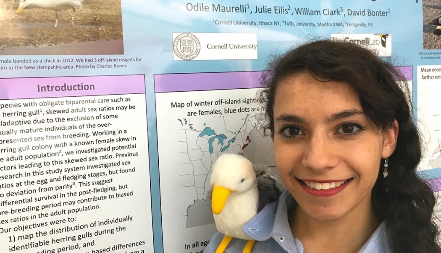 Odile Maurelli stands by her poster at Forum