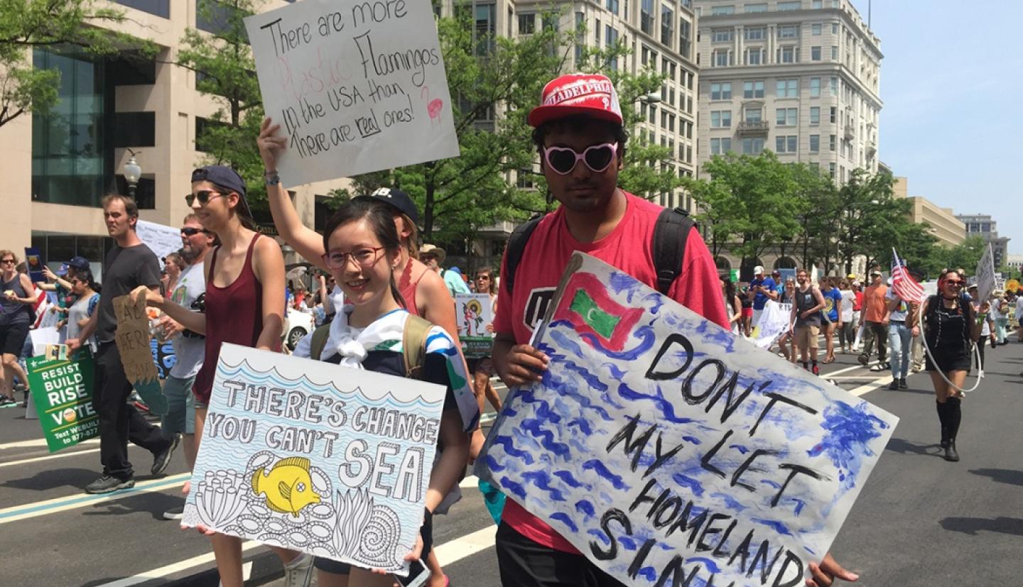 Jacqueline Wong and Hassan Saleem walk down Pennsylvania Avenue