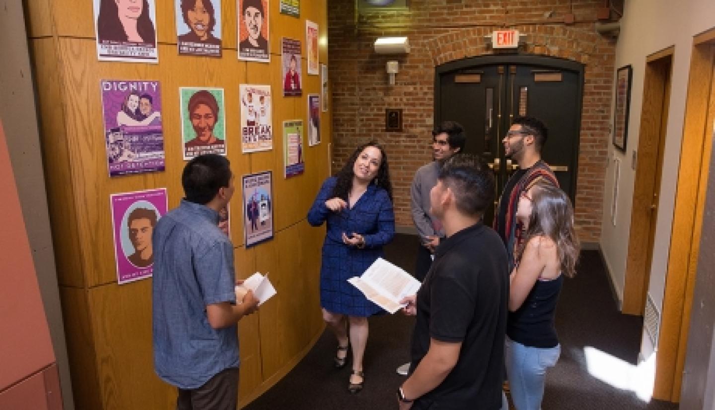 Professor Ella Diaz talks to installation attendees 