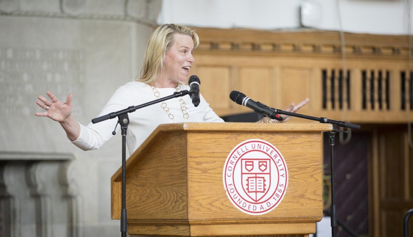Cathy Merrill Williams speaking at podium