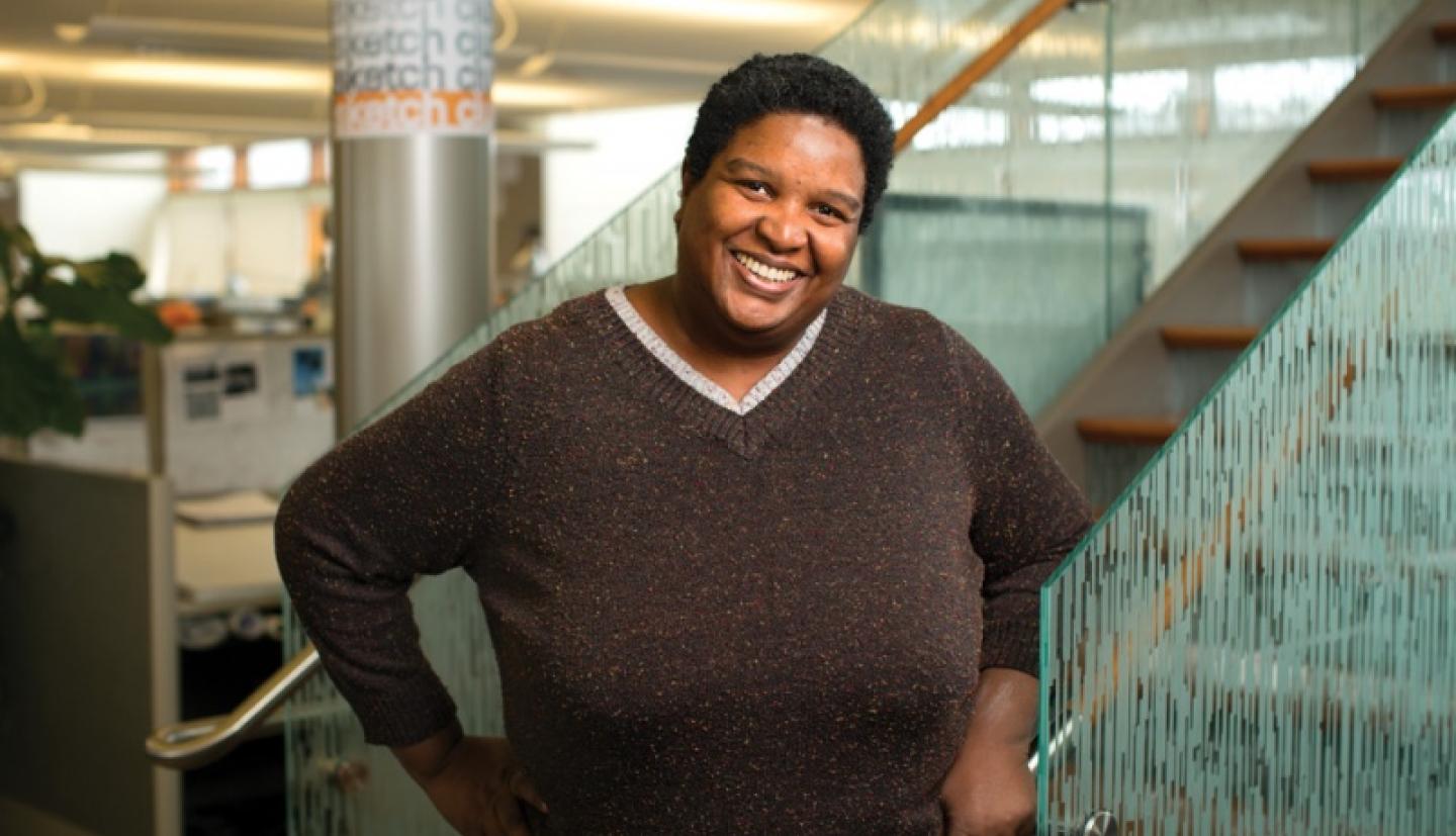 Valerie Aymer standing smiling