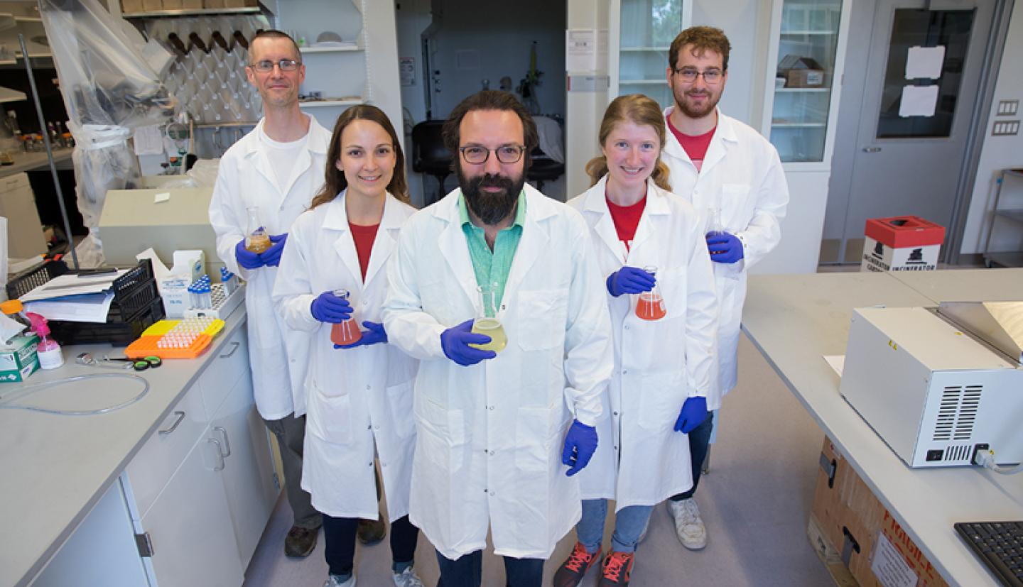 Professor and lab members in lab