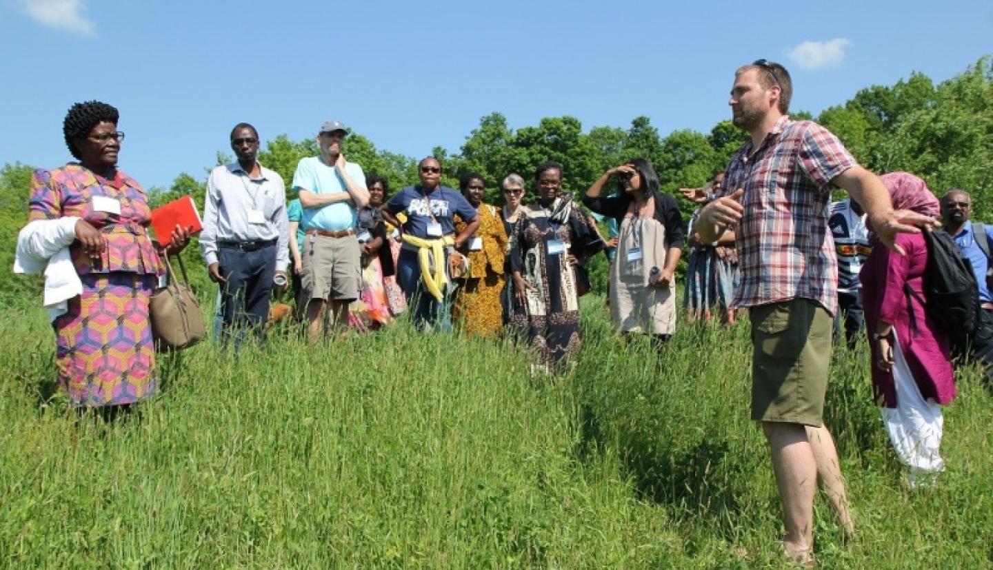 Members of the ELC stand in a field