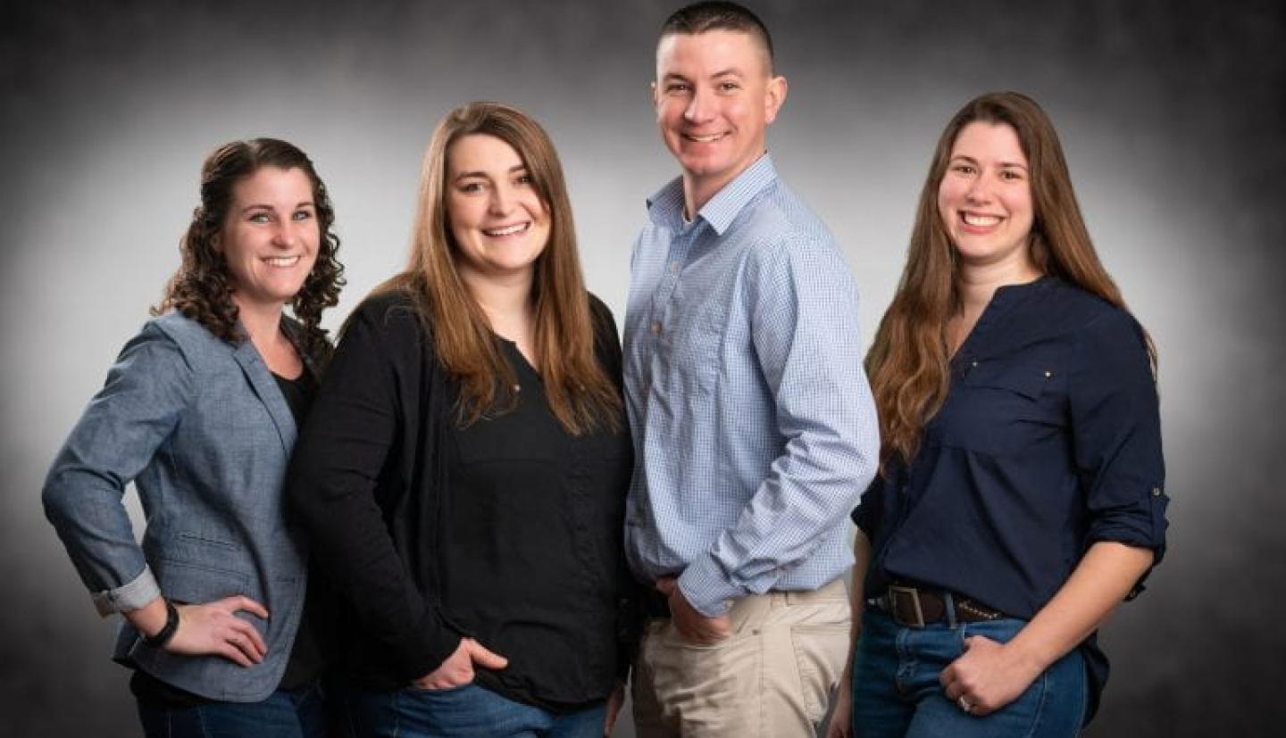 Four specialists posing for team picture 